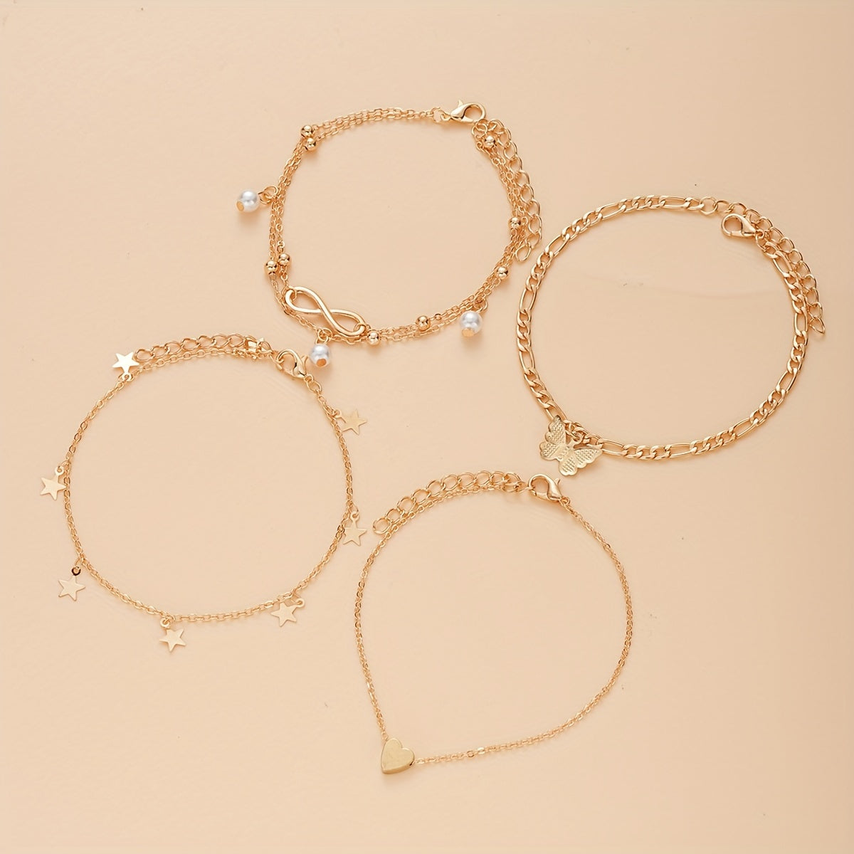 Bohemian Chic 4-Piece Anklets Set, Golden With Heart, Butterfly, Infinity & Star Charms, Faux Pearl Accents, Metal Anklets For Beach Party
