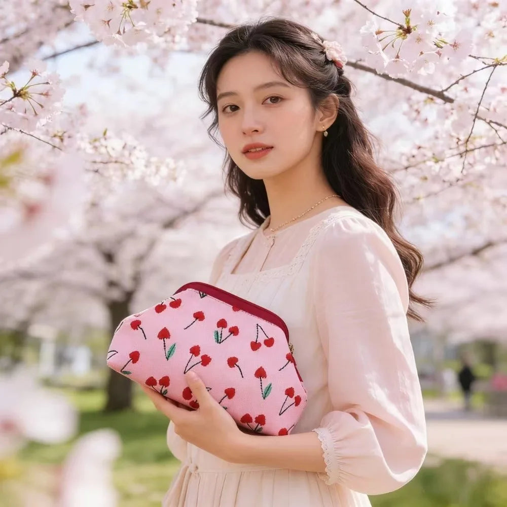 New women's cherry embroidery printed handbag, fashionable and convenient fly-knitted bag, versatile commuter cloud bag.
