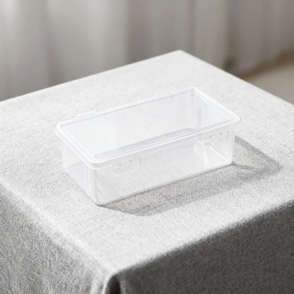 The white plastic storage box is tightly sealed, lightweight and durable, and is a multifunctional home storage tool.