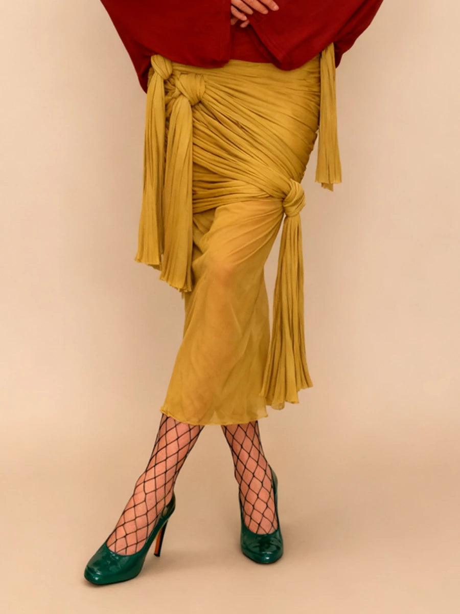 VGH Sexy Yellow Color Bodycon Midi Length Skirts for Women High Waist Spliced Bandage Folds See Through Skirt Female Autumn New