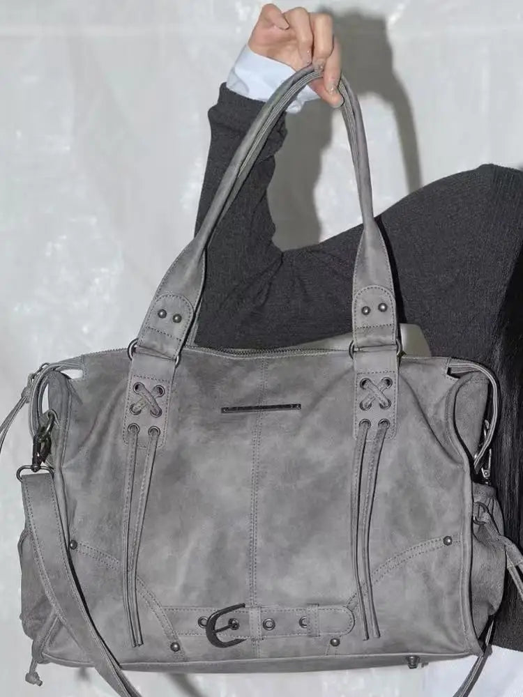 Korean brand FANCY CLUB: Large Capacity Retro Fancyclub Tote Bag with Rivets and Straps – A Motorcycle-Style Bag for Women.